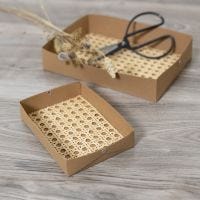 Make trays from faux leather paper decorated with rattan