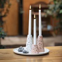 A dish and candlesticks from bamboo fibres decorated with terrazzo flakes
