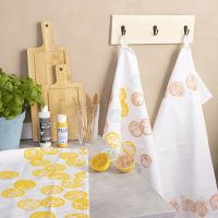 Stamped designs on fabric using fruit and vegetables