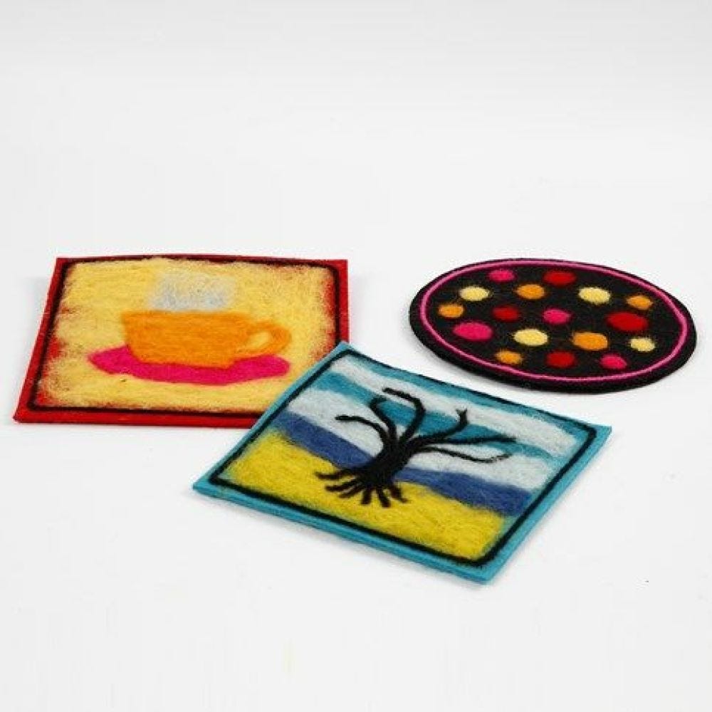 A Trivet made from thick Felt with needle felted Decoration