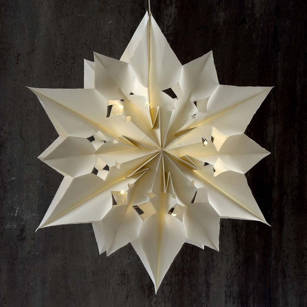 A large and shining Star made from Paper Bags