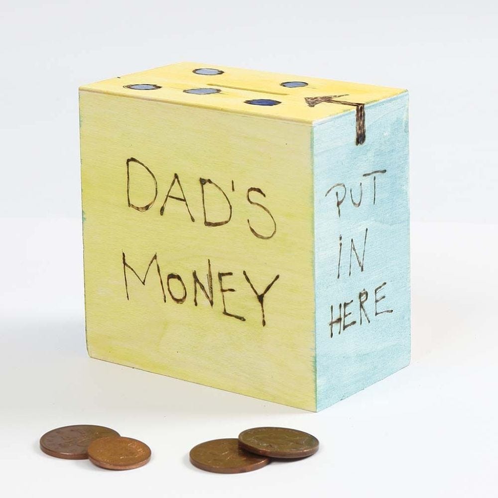 A wooden Money Box decorated with branded Designs and Paint