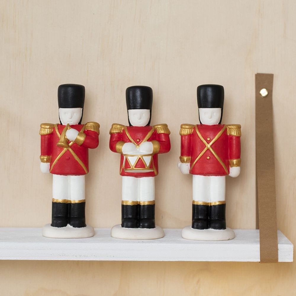 A Terracotta Nutcracker decorated with Plus Color