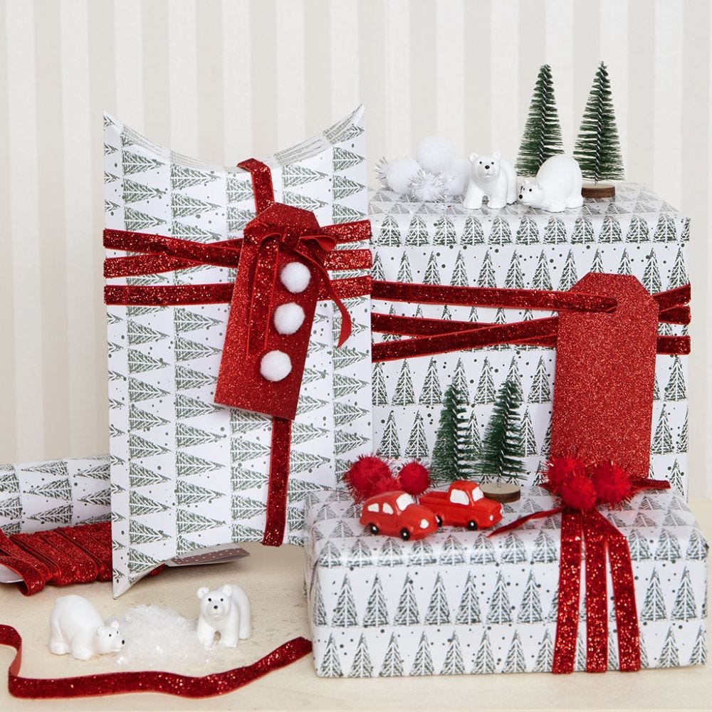 Christmas Gift Wrapping decorated with Pom-poms and Miniature Figures