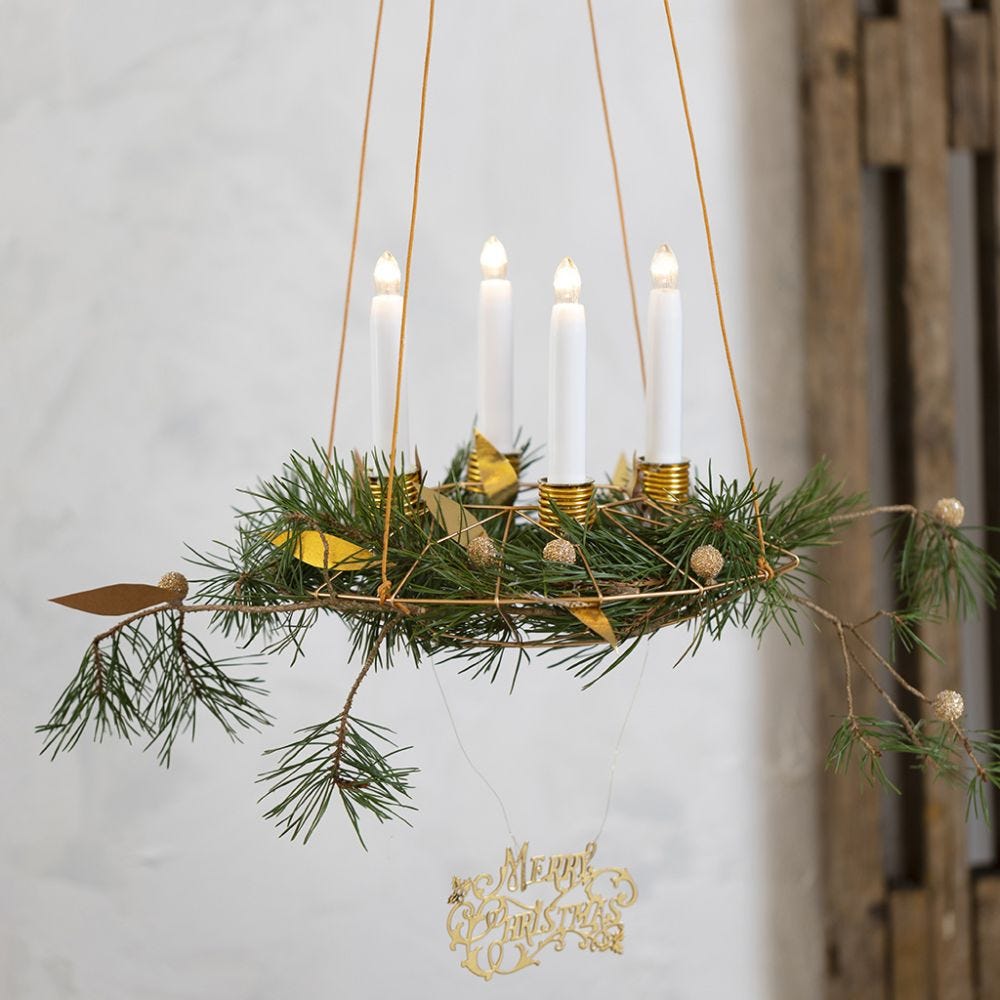 A hanging Advent Wreath with Candle Holders from Bonsai Wire and Faux Leather Paper Decorations