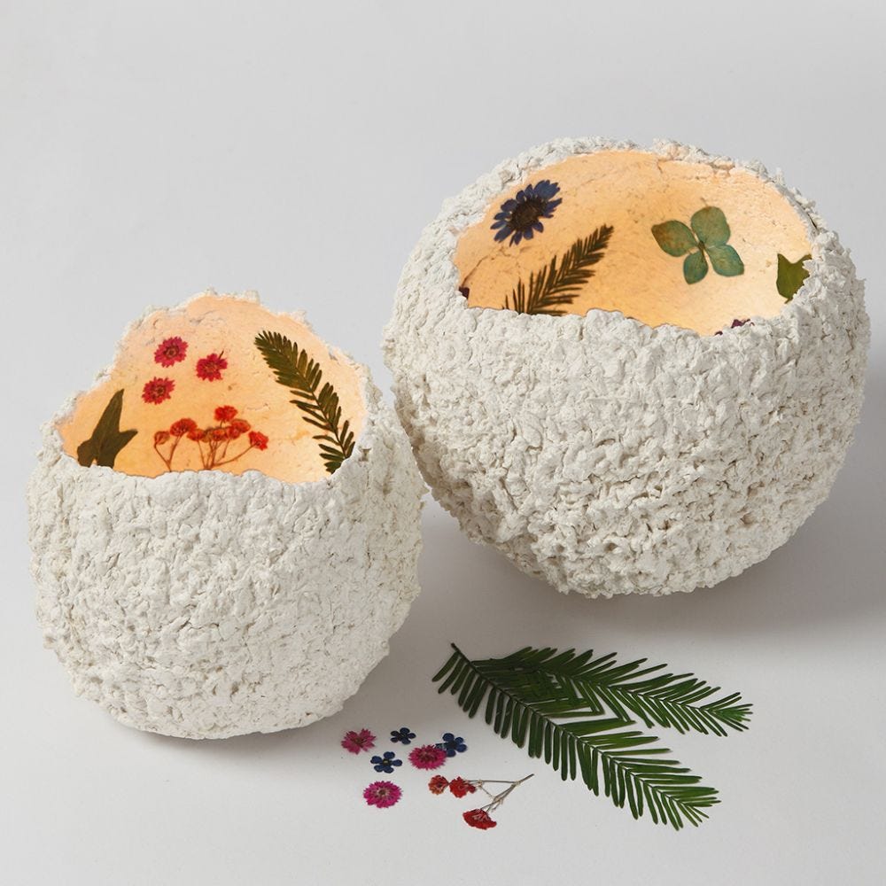 Lanterns from papier-mâché pulp decorated with dried flowers