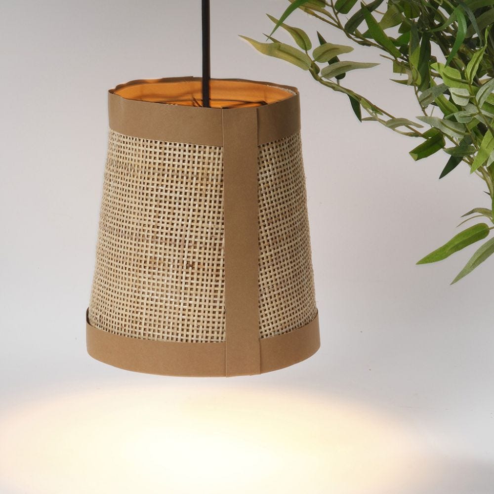 A lamp shade from faux leather paper and rattan