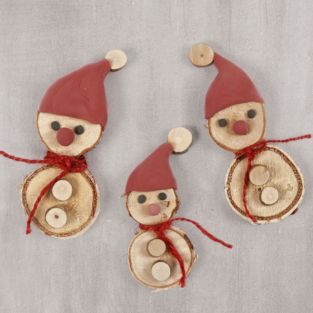 Elves made from wooden discs with a Silk Clay elf's hat