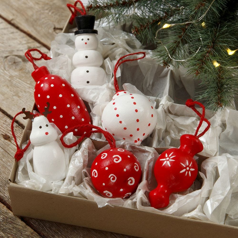 Wooden figures and wooden Christmas baubles for hanging decorated with craft paint