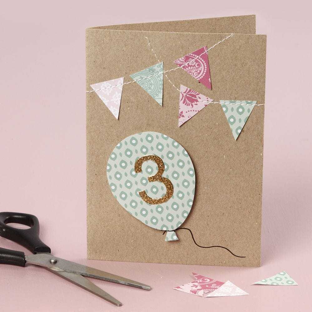 A birthday card with sewn-on details