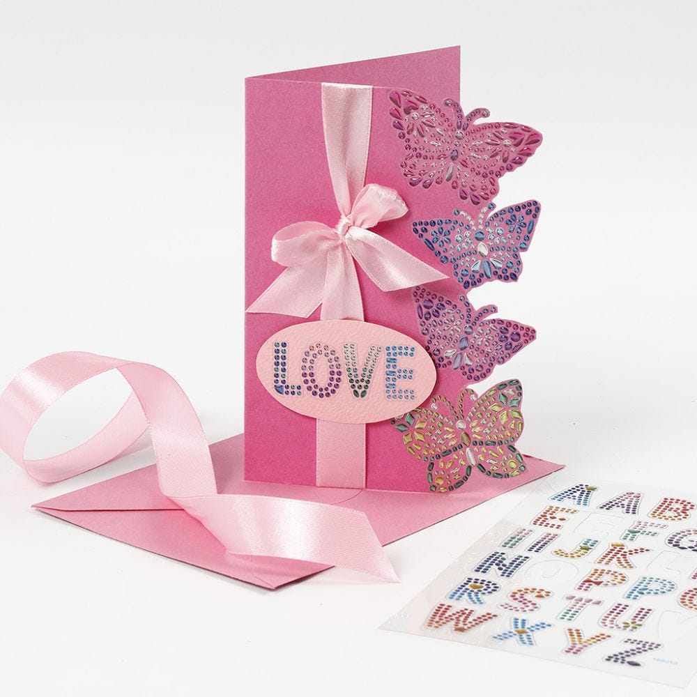 A greeting card decorated with diamond sticker butterflies