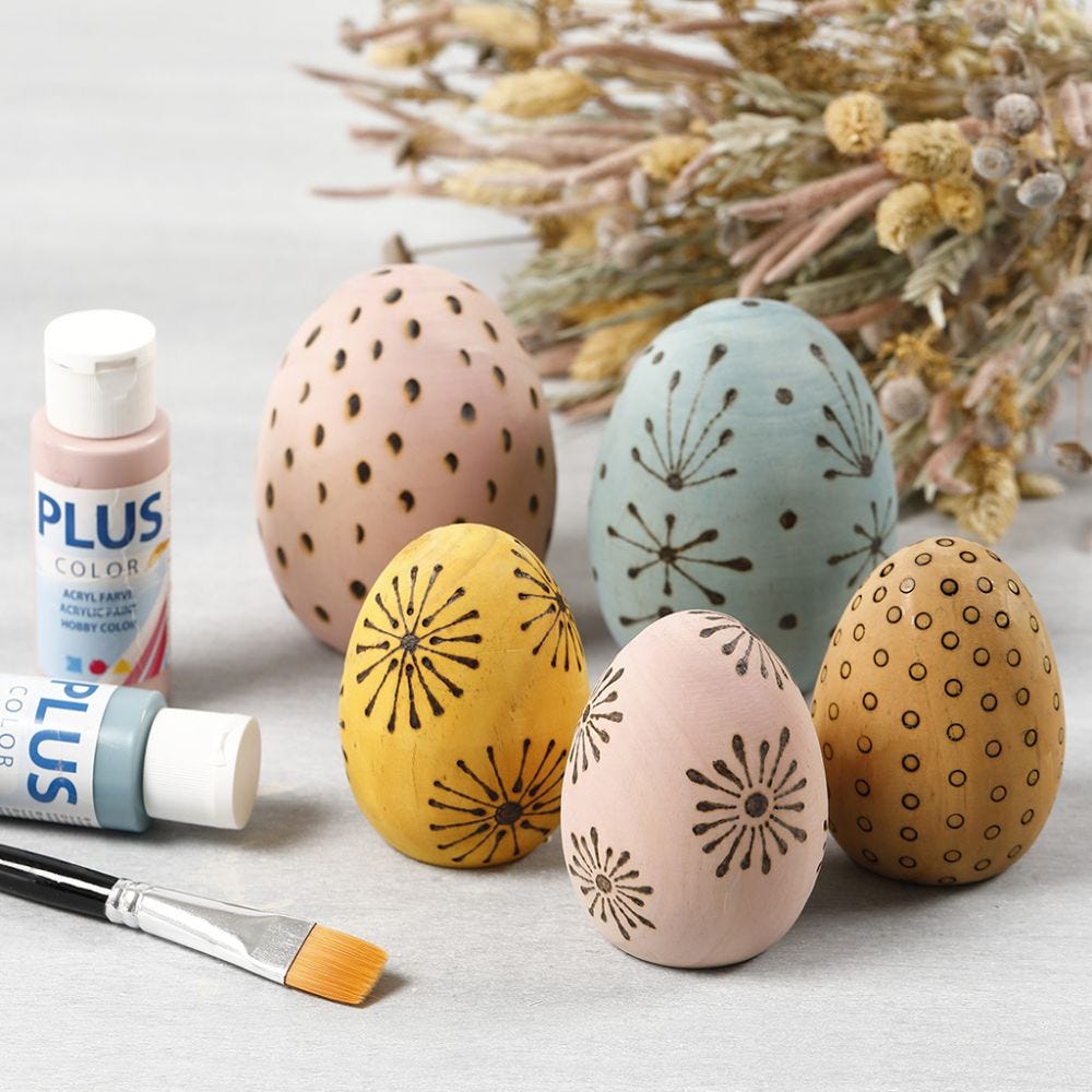 Stained wooden eggs decorated with a pyrography tool