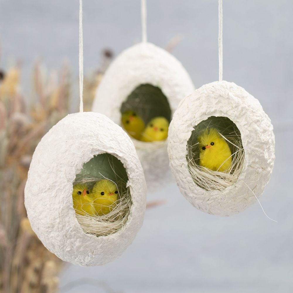 Easter eggs from pulp with a hole decorated with nesting chicks