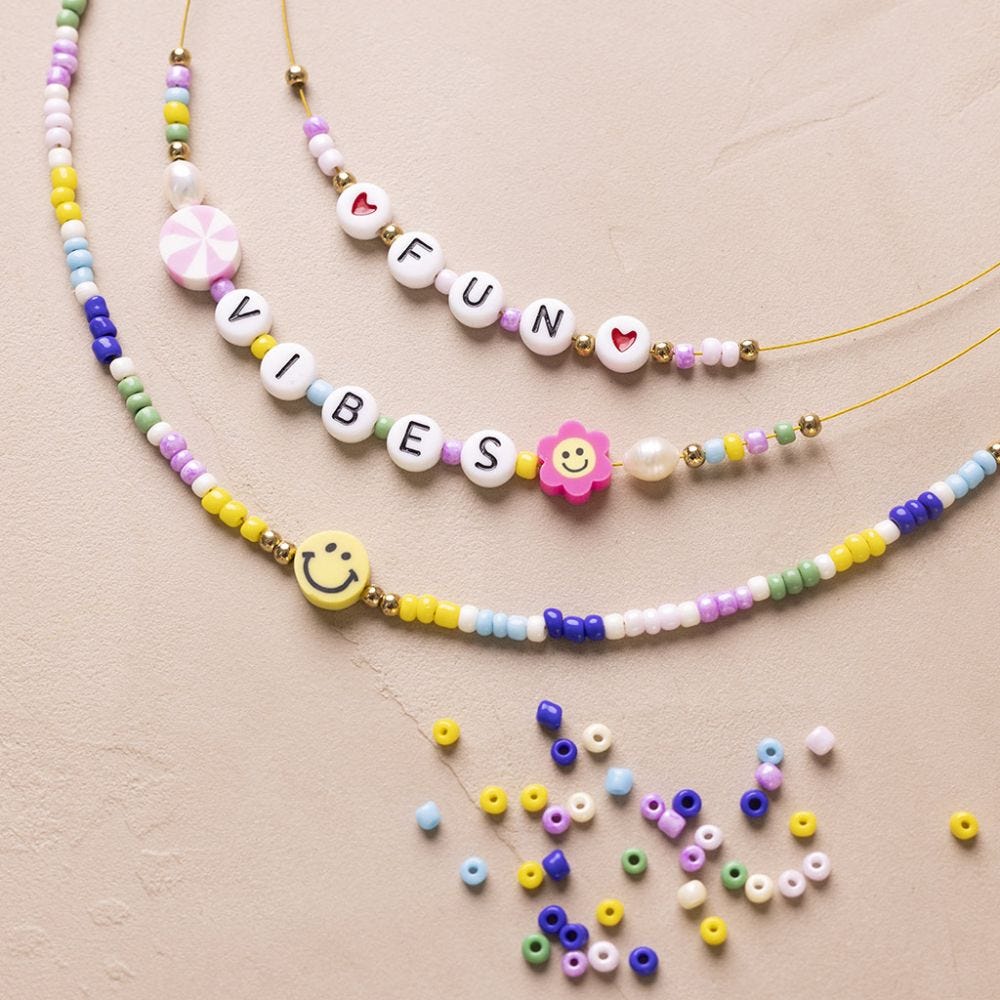 Bead necklace with letters and figures