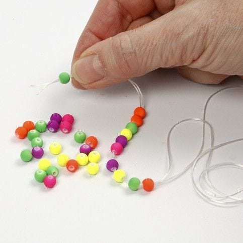 How to thread store beads onto elastic