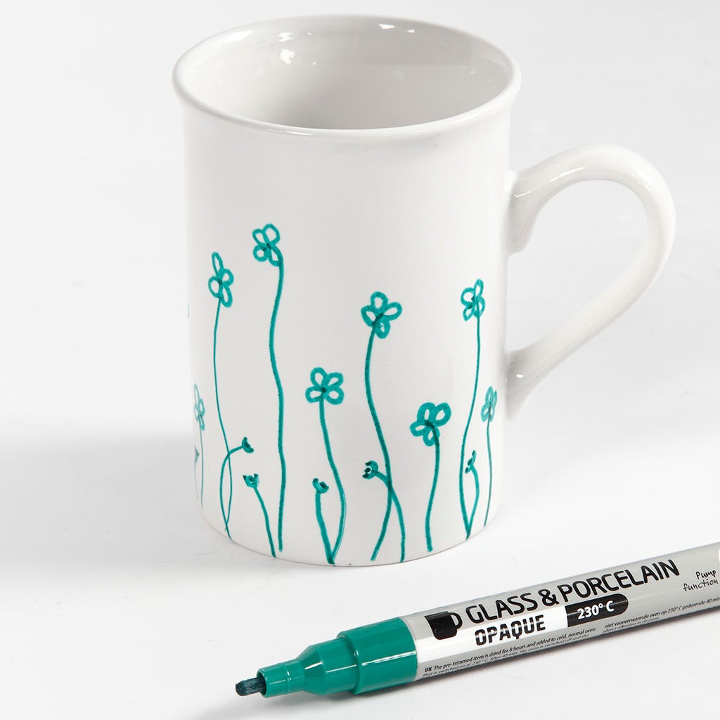 Porcelain mugs decorated with flowers drawn with glass porcelain